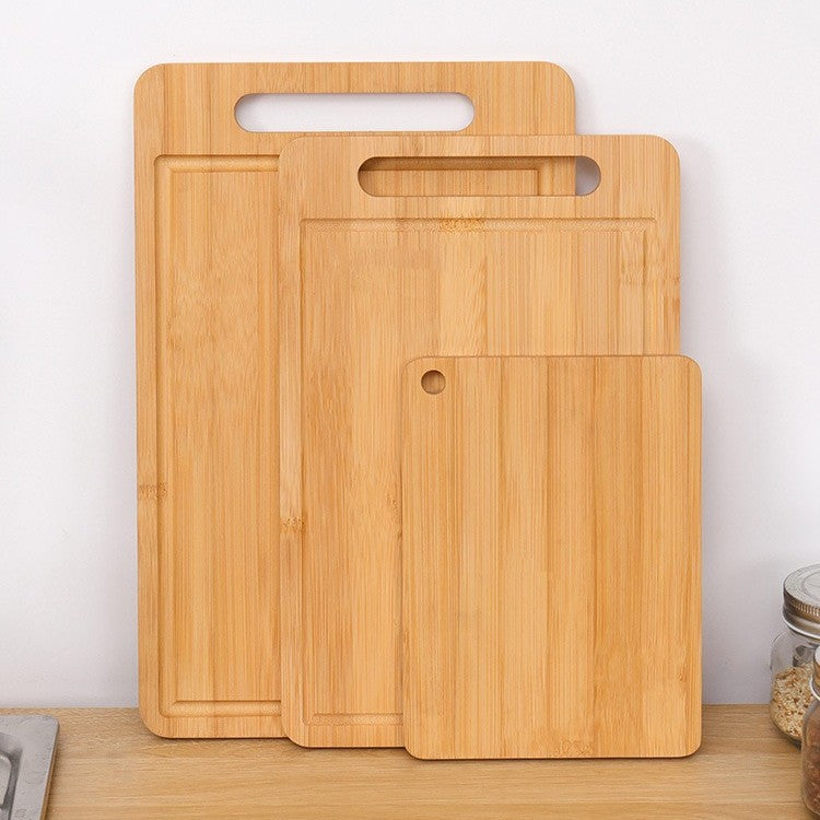 Bamboo cutting board next to wood cutting board comparison