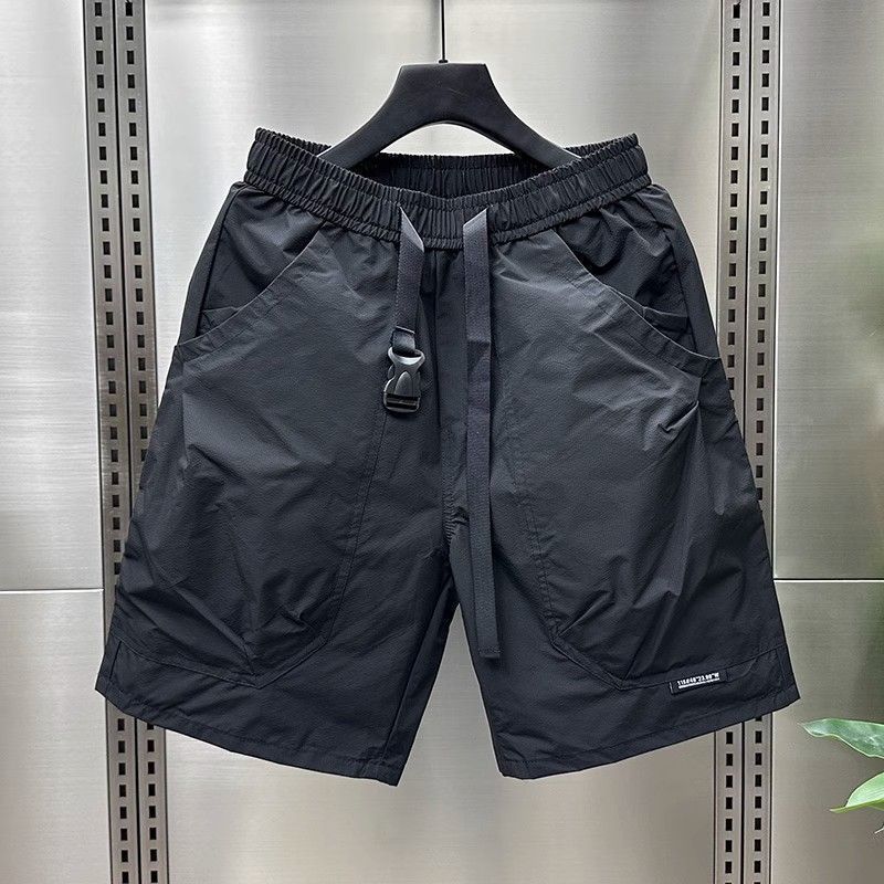 Black cargo shorts with a smooth finish and black drawstring