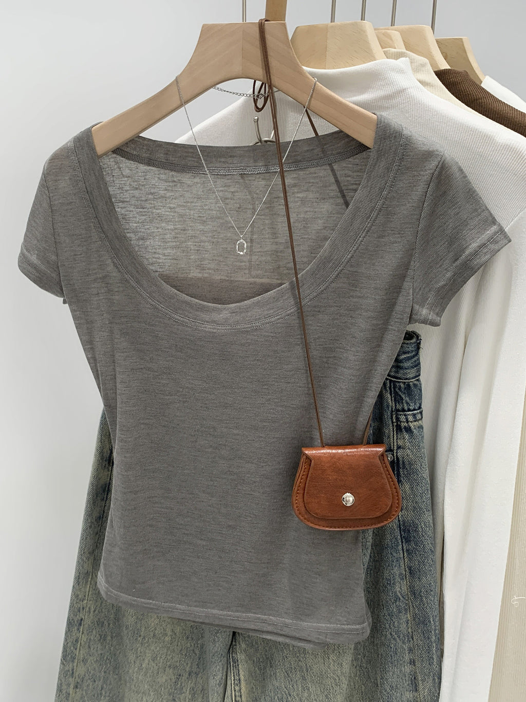 Grey women's scoop neck t-shirt styled with jeans