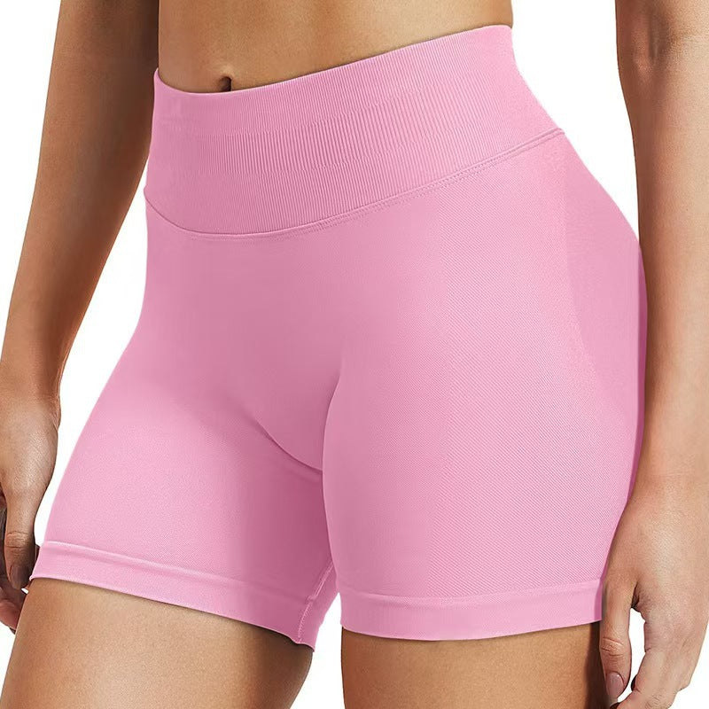 Pink high waisted butt lifting yoga shorts side view