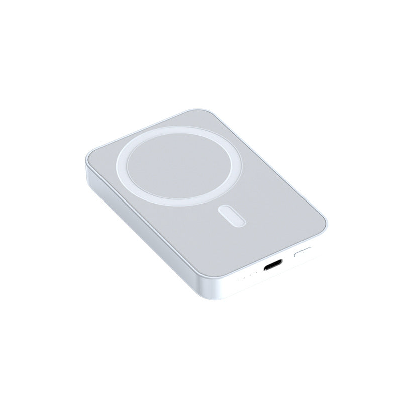 MagSafe magnetic power bank in pink attached to iPhone for fast charging