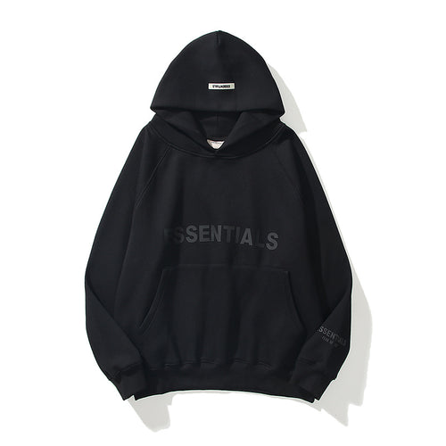Black hoodie with 'ESSENTIALS' text on a white background