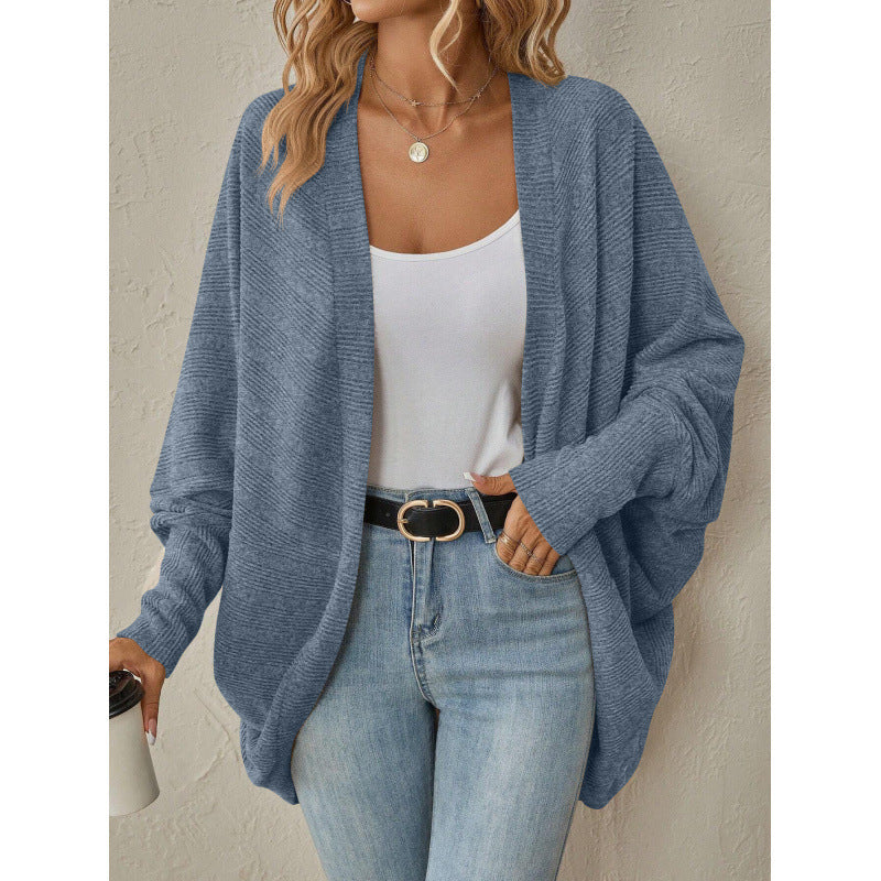Blue oversized open front cardigan styled with a white tank and jeans