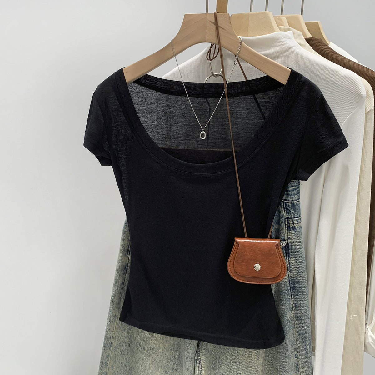 Black women's scoop neck t-shirt neckline close-up