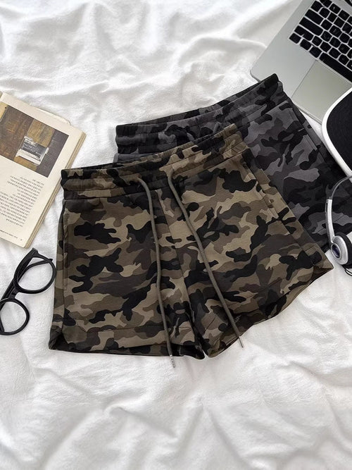 Women's high-waisted camo shorts in army green - front view