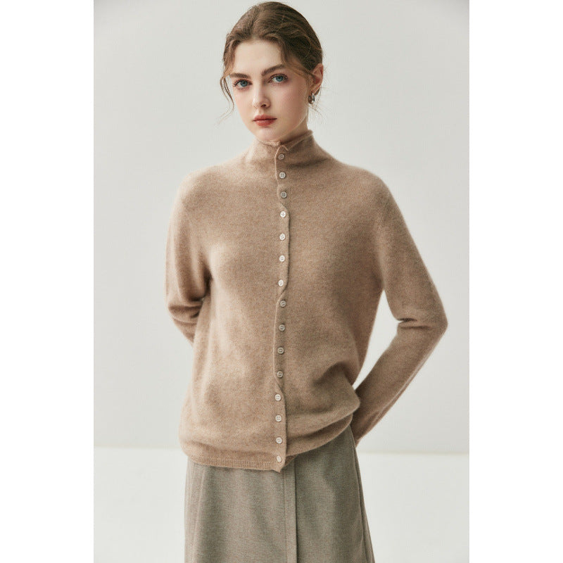 Elegant camel high neck cashmere cardigan, hands clasped