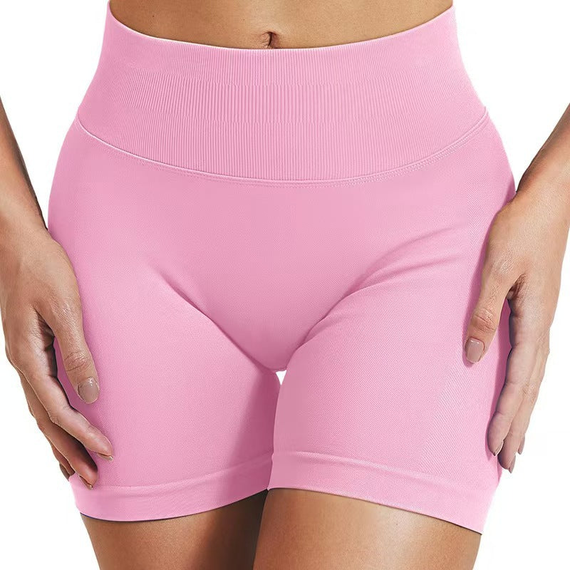 Women's high waisted yoga shorts in pink front view