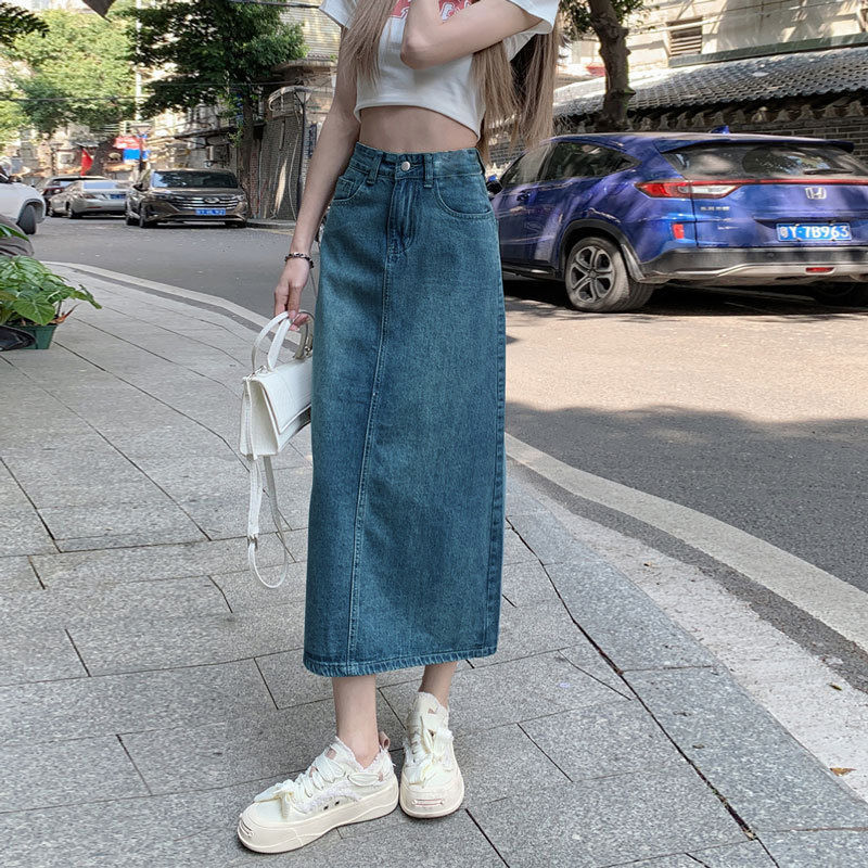 Vintage blue high waisted denim maxi skirt, street style front view