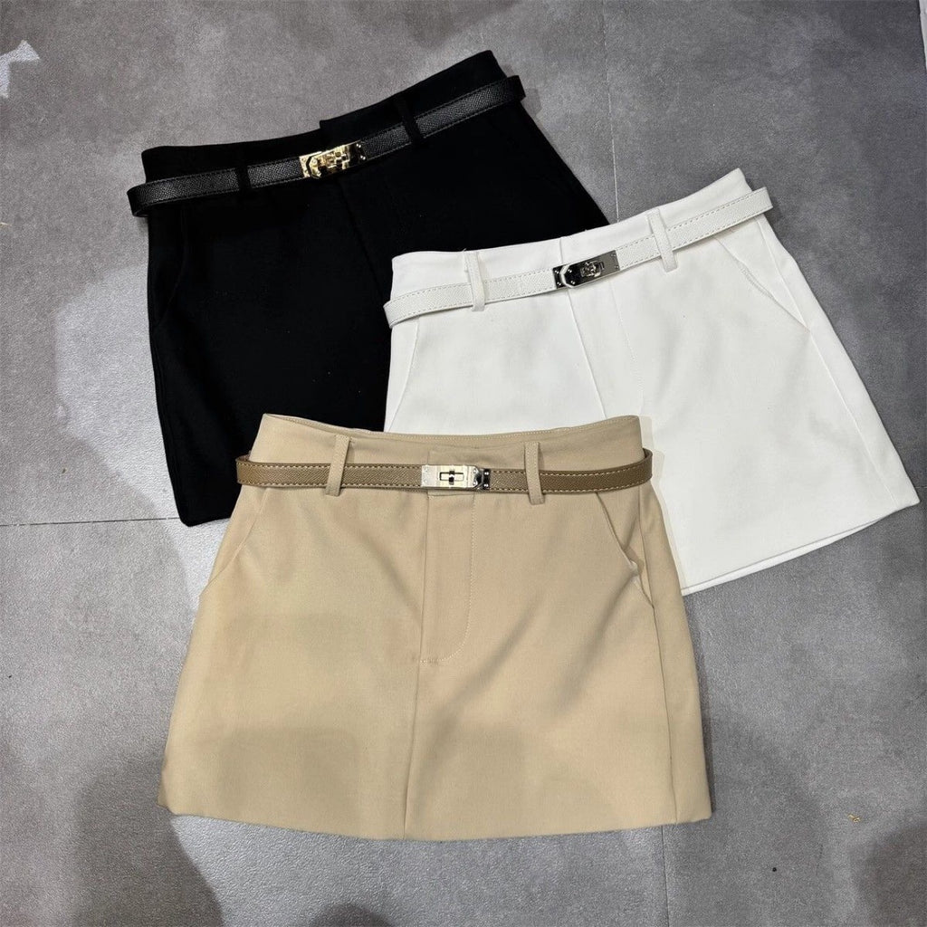 "High waisted mini skirts in khaki, white, and black with belt"

