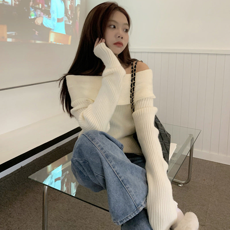 Cream fold over off the shoulder pullover sweater with long sleeves styled with wide-leg jeans