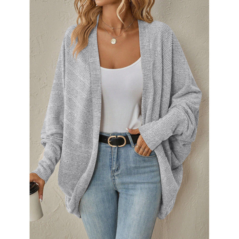 Close-up of the gray cardigan's open front and V-neck drape