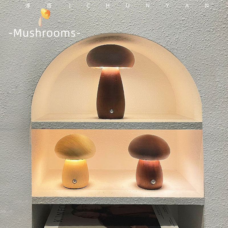 Small and large wooden mushroom lamps displayed together in a modern arched shelf niche”