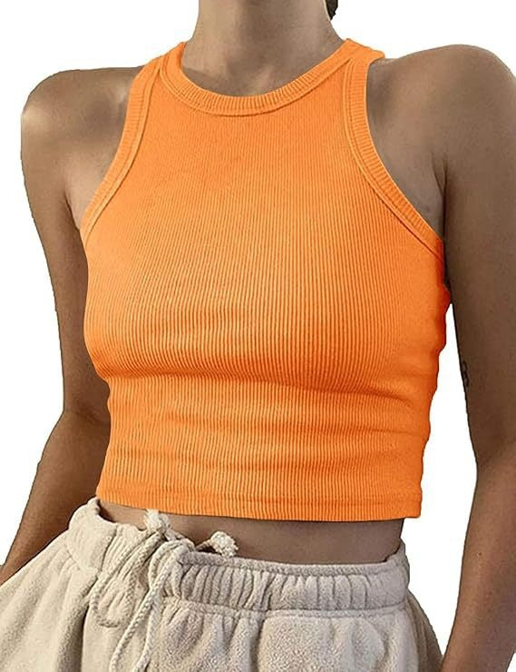 Model wearing ribbed racerback tank top in pink, alternate angle