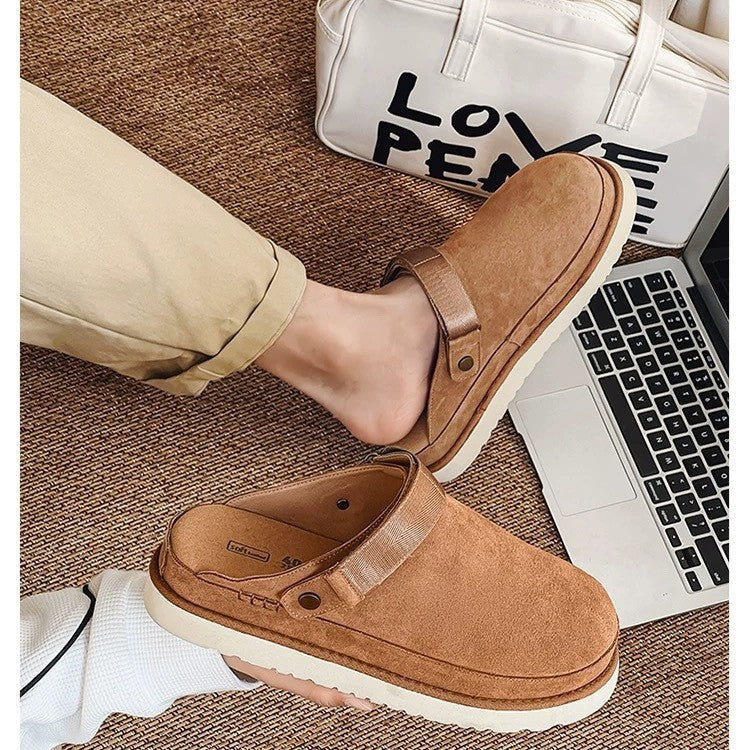 Woman wearing cozy tan fleece lined cork sandals indoors with laptop in background
