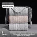 Folded stack of cotton kitchen dish cloths in brown stripe