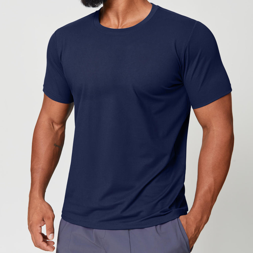 Man wearing navy blue dri-fit gym shirt, three-quarter side view