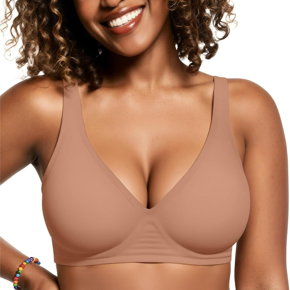 Smiling woman wearing a seamless wireless jelly bra with deep V neck, front view