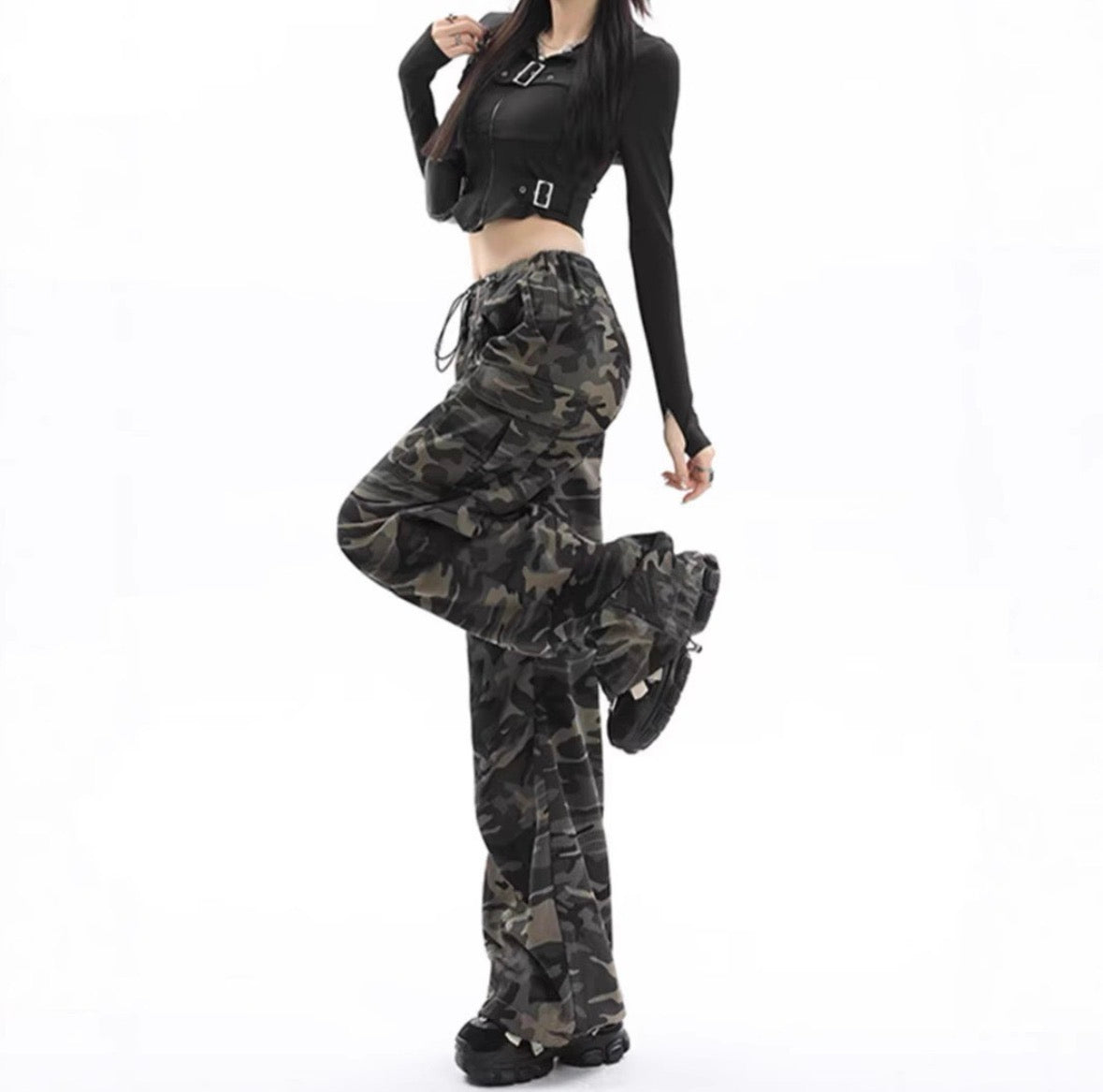 Camo cargo pants side pose styled with black crop top and boots