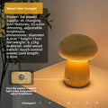 Rechargeable wooden mushroom lamp glowing in warm yellow light, showing adjustable brightness features