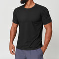 Man wearing premium black dri-fit gym shirt, front view