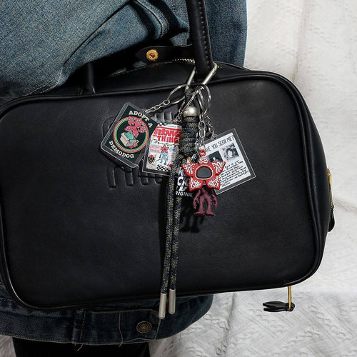 Black bag with decorative “stranger things” “demogorgon”  keychain 