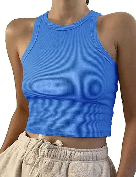 Model wearing ribbed racerback tank top in pink, close-up view