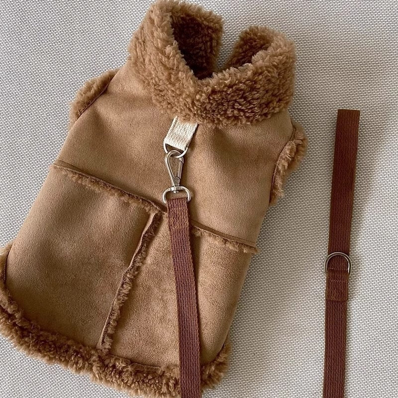 Brown faux suede dog vest with soft fleece-style collar and trim, front flat lay view