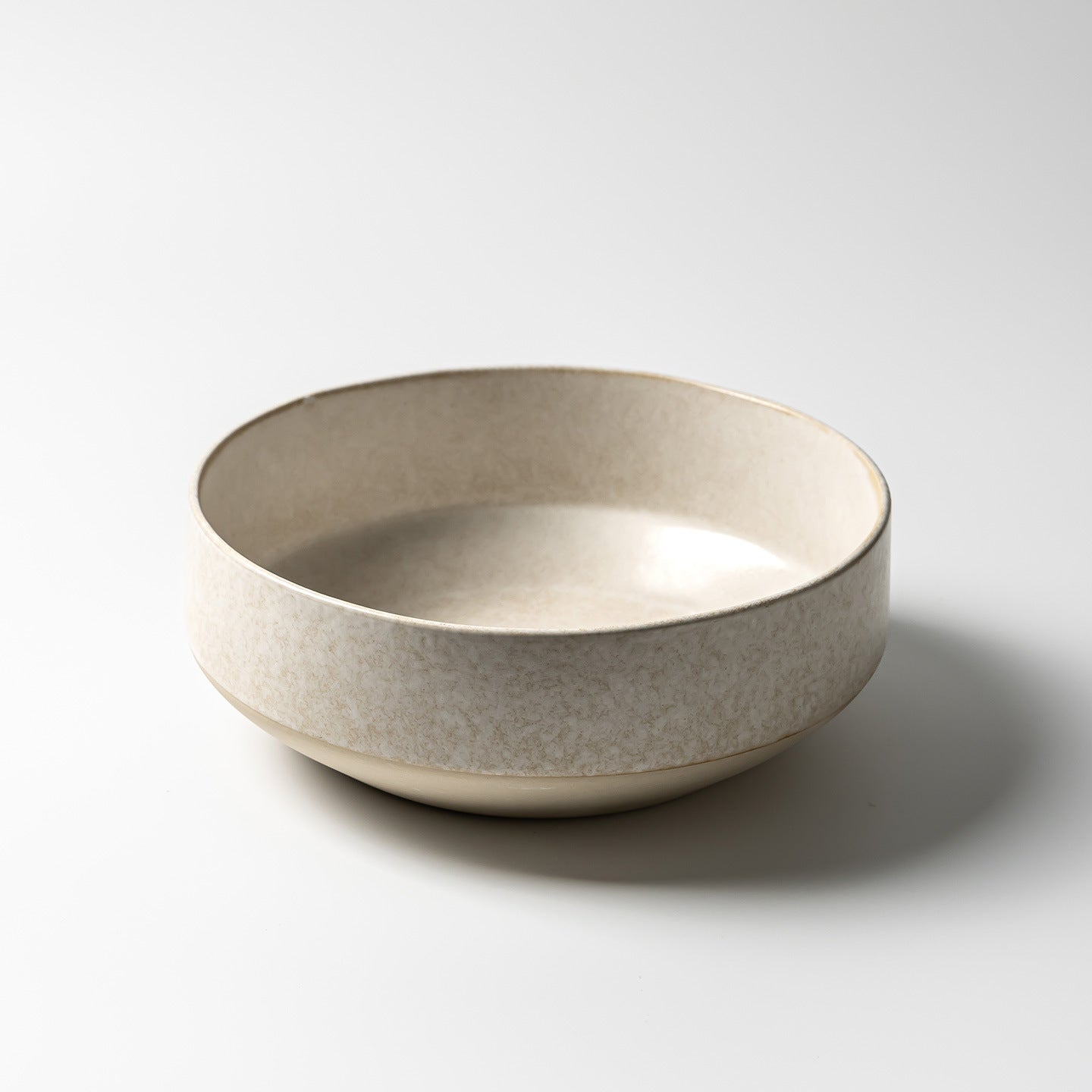 Japanese retro ceramic dinner bowl in frost flower white glaze, round minimalist design with textured surface.