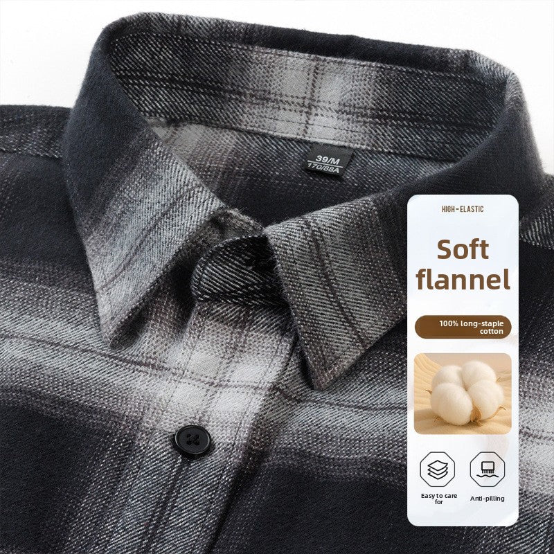 Black plaid flannel shirt collar and button close-up, detail view