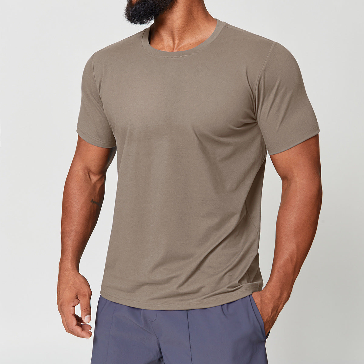 Man wearing mocha breathable workout t-shirt, alternate front view