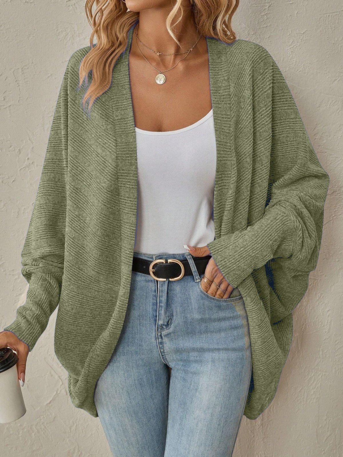 Army green long sleeve cardigan styled with high-waisted jeans
