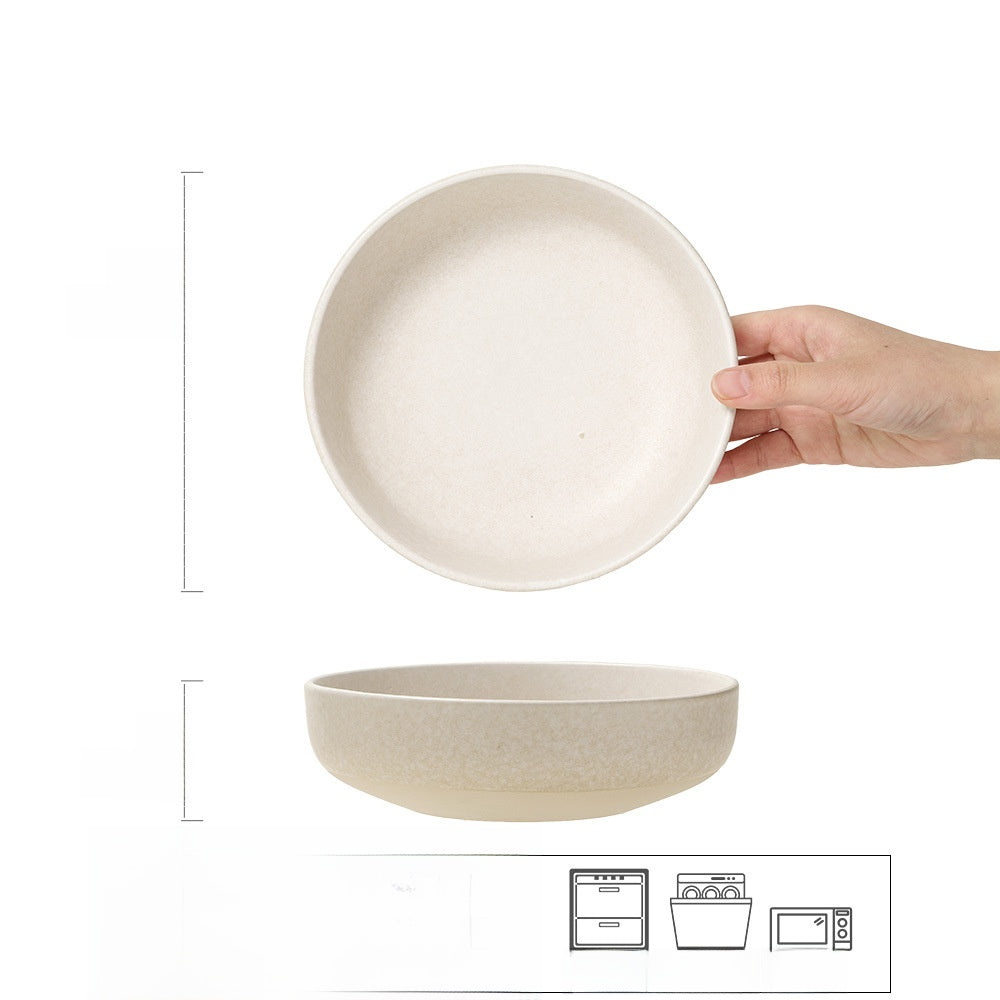 Hand holding a Japanese retro ceramic dinner plate in frost flower white glaze above a matching small bowl, showing thickness and shape.