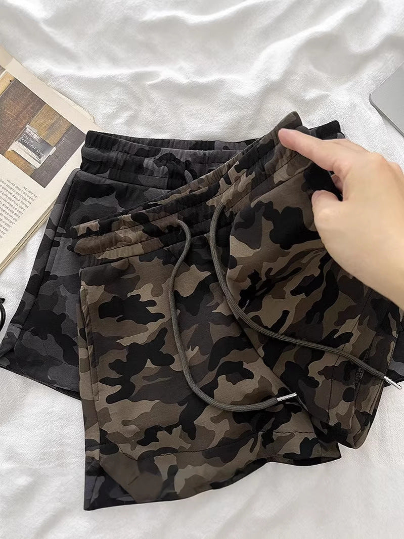 Close-up of camouflage pattern fabric on wide-leg capri shorts